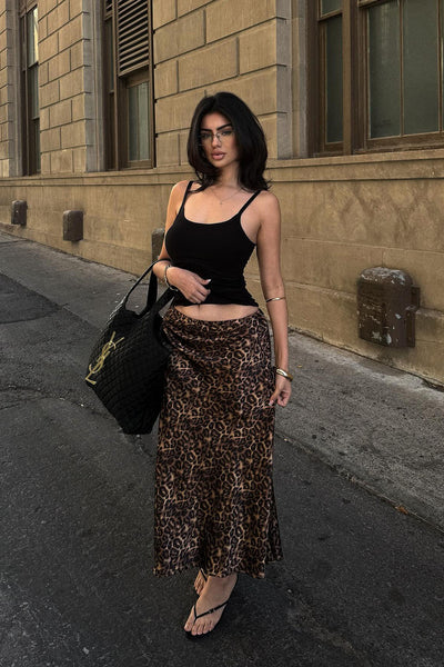 https://cdn.shopify.com/s/files/1/0293/9277/files/01-12-26_Micah_Satin_Leopard_Print_Midi_Skirt_Leopard_032_JR.jpg?v=1774044549&with=400&height=600