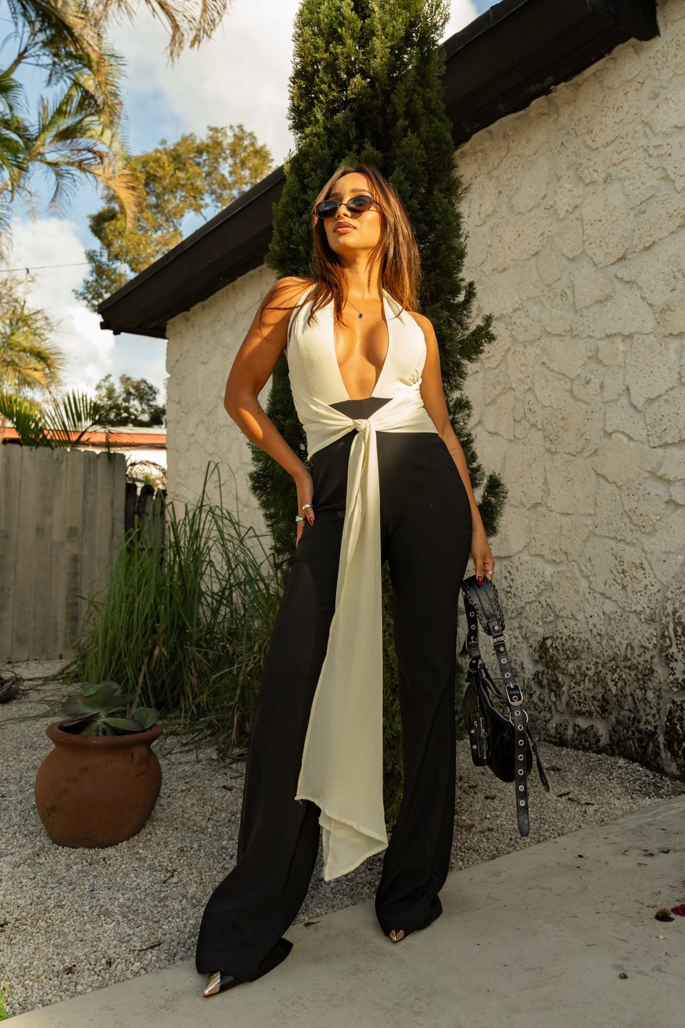 https://cdn.shopify.com/s/files/1/0293/9277/files/03-09-26_Soft_Touch_Drape_Jumpsuit_Black-White_064_MH.jpg?v=1779213326
