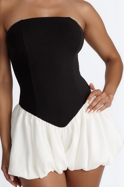 https://cdn.shopify.com/s/files/1/0293/9277/files/05-18-26_S9_54_B126RP0703_BlackWhite_JG_MC_15-18-28_1661-FN_Remi-_PXF.jpg?v=1780328987&with=400&height=600