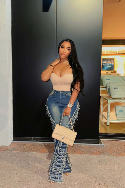 https://cdn.shopify.com/s/files/1/0293/9277/files/3-18-24__029_Feeling_Brand_New_Tinted_Flare_Jeans_Medium_Wash_LA.jpg?v=1747073996&with=400&height=600