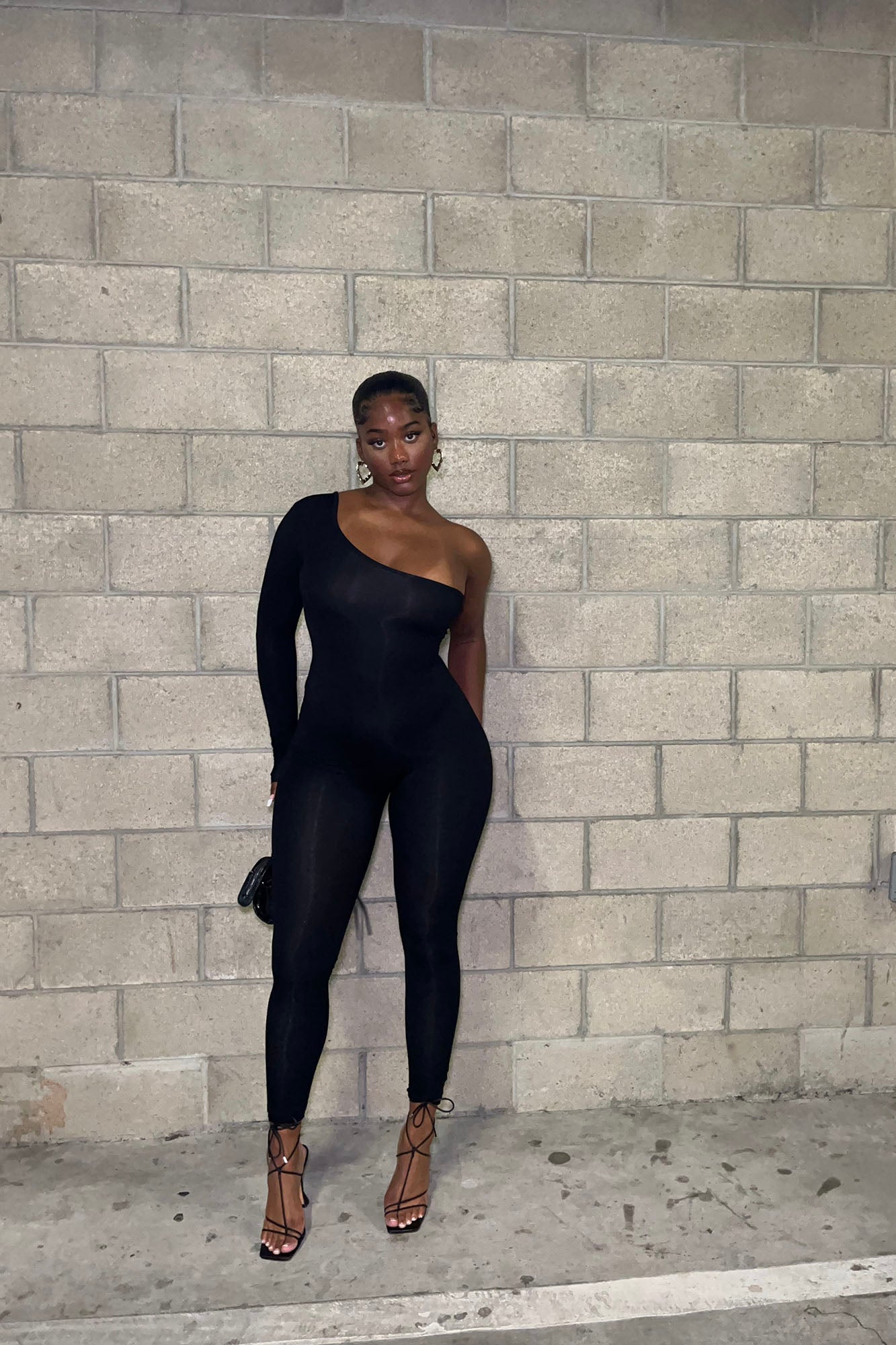 https://cdn.shopify.com/s/files/1/0293/9277/files/6-11-2024__221_Nova_Season_Long_Sleeve_One_Shoulder_Jumpsuit_Black__1__GF.jpg?v=1722558279