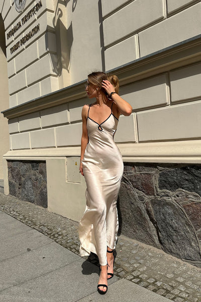 https://cdn.shopify.com/s/files/1/0293/9277/files/6-17-2024__049_Saisha_Satin_Maxi_Dress_Cream_GF.jpg?v=1767897050&with=400&height=600