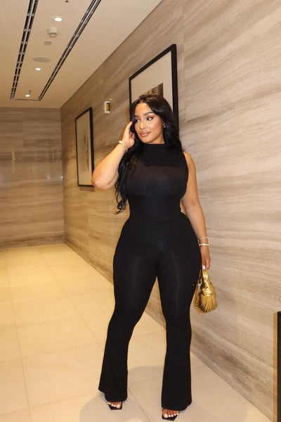 https://cdn.shopify.com/s/files/1/0293/9277/files/6-3-2024__066_No_Vacancy_Jumpsuit_Black_GF.jpg?v=1718143561&with=400&height=600