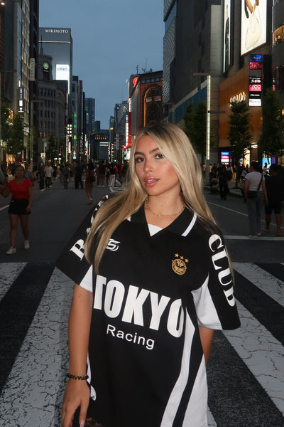 https://cdn.shopify.com/s/files/1/0293/9277/files/9-23-2024__217_Tokyo_Crowd_Pleaser_Polo_Tee_Black_LA.jpg?v=1755280069&with=400&height=600