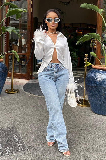 https://cdn.shopify.com/s/files/1/0293/9277/products/StepWaistbandCrossoverJeans-LightBlueWash_MER.jpg?v=1678408800